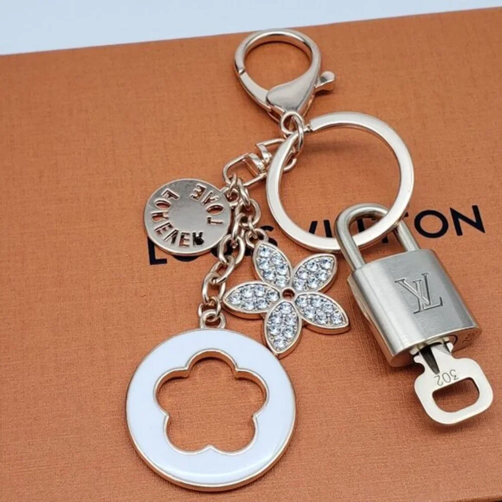 Authentic Louis Vuitton Gold Lock & Box w/ Unbranded Flower Bagcharm 120825
